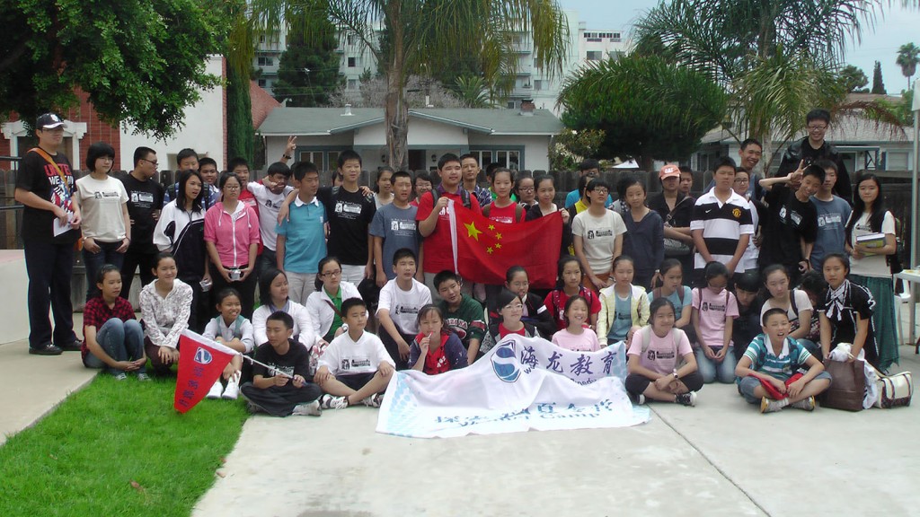 Chinese students pose for a picture outside their ESL classroom